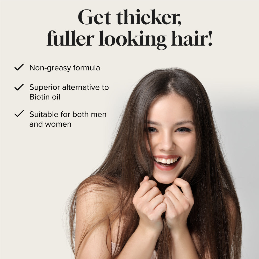 Front view of serum bottle with Pureauty Naturals Biotin Hair Serum label visible